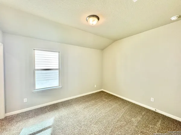 a view of a room that has a window in it