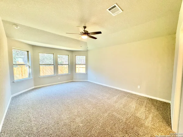 a view of an empty room with a window