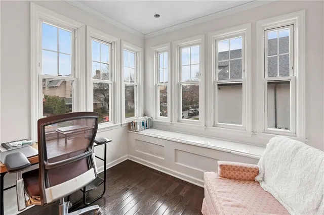 a living room with furniture and windows