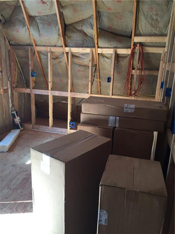 1063 Meadow Pond Road Islesboro, ME 04848 - Photo 12 of 20 kitchen area with cabinets in boxes