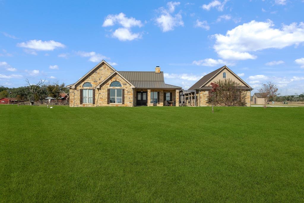 a view of a house with a big yard
