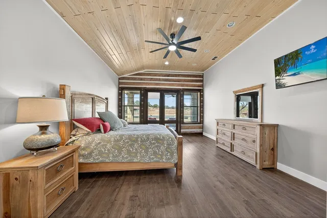 a bedroom with a bed and a table