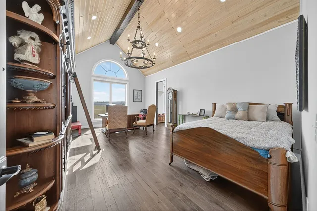 a bathroom with a sink mirror and shower