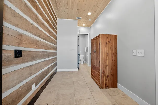 a view of a wooden deck and a yard