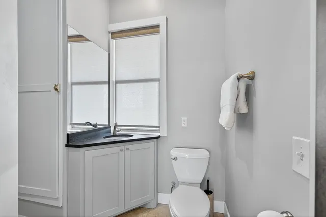 a view of a patio with a table and chairs