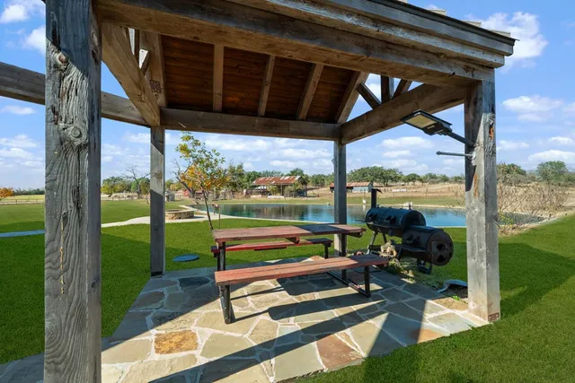 a view of a lake with houses in the back