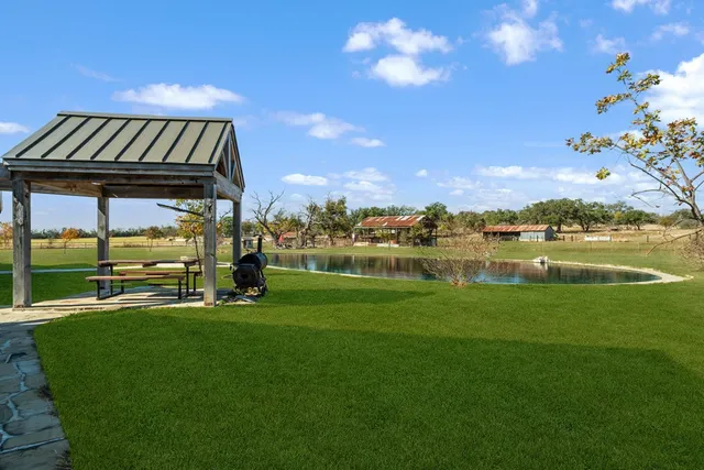 a view of a lake with houses in the back