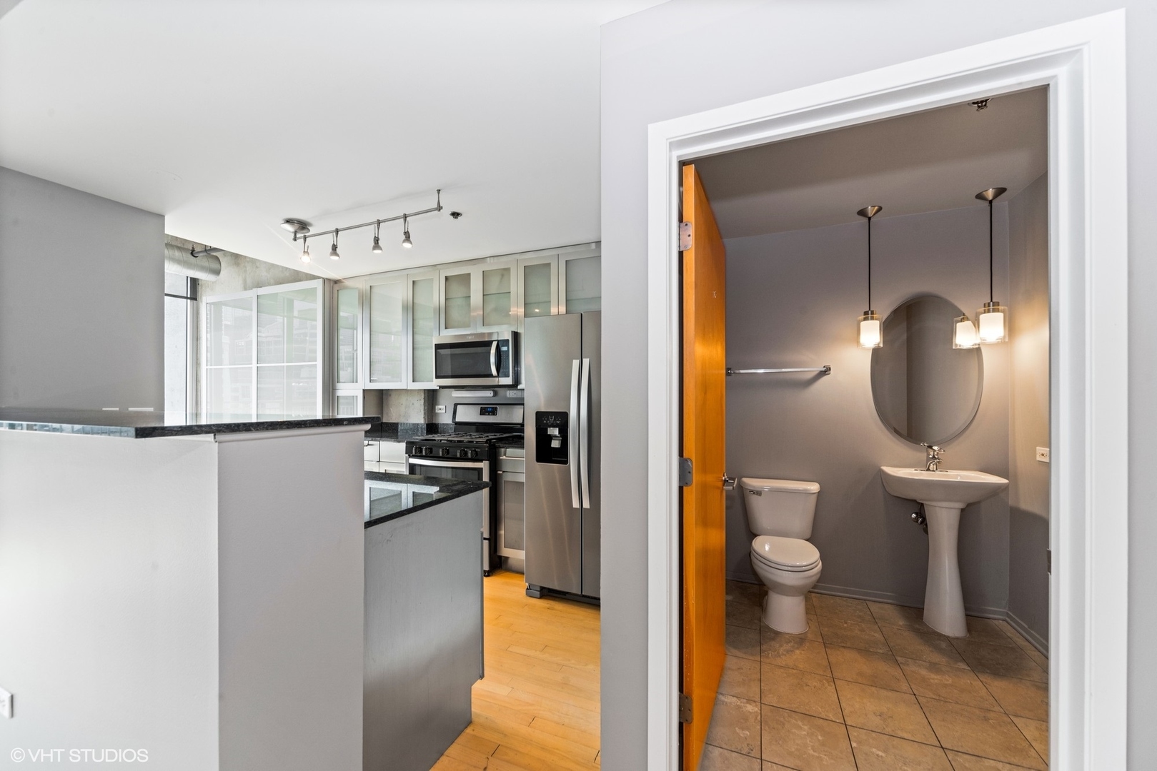700 West Van Buren Street, Unit PH3 Chicago, IL 60607 - Photo 6 of 20 a bathroom with a toilet sink and shower