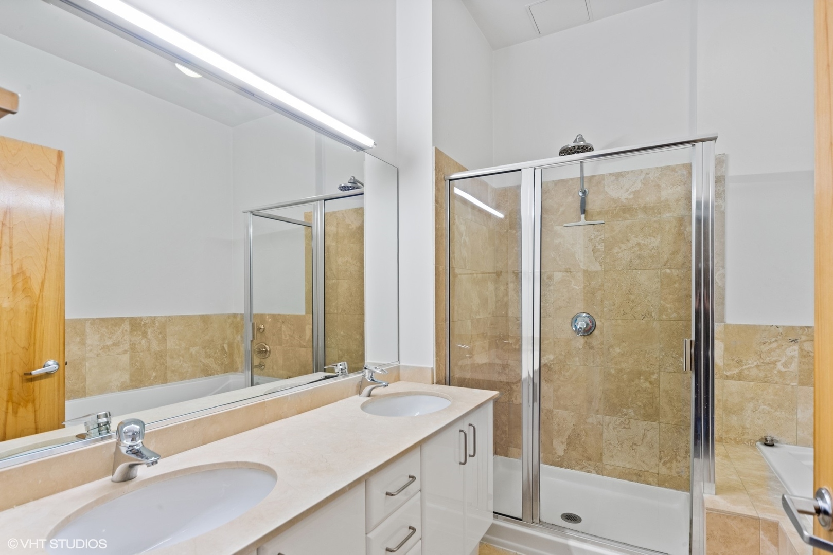700 West Van Buren Street, Unit PH3 Chicago, IL 60607 - Photo 8 of 20 a bathroom with a shower sink vanity granite and mirror
