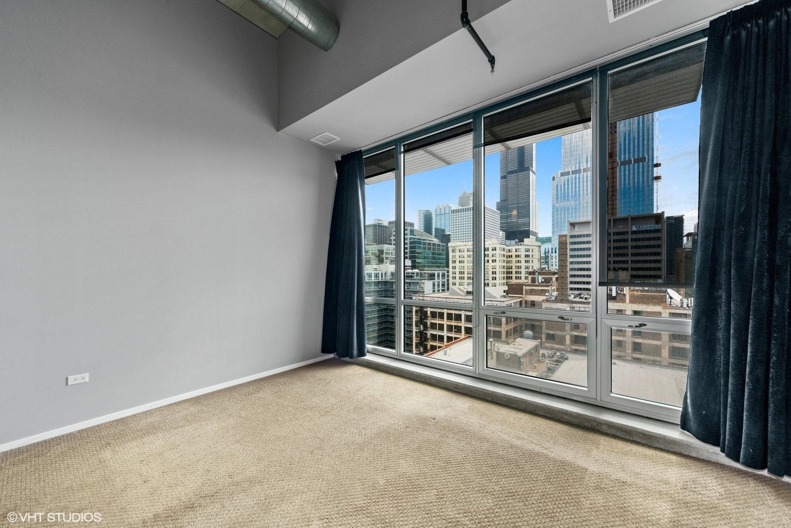 700 West Van Buren Street, Unit PH3 Chicago, IL 60607 - Photo 9 of 20 a view of an empty room with windows