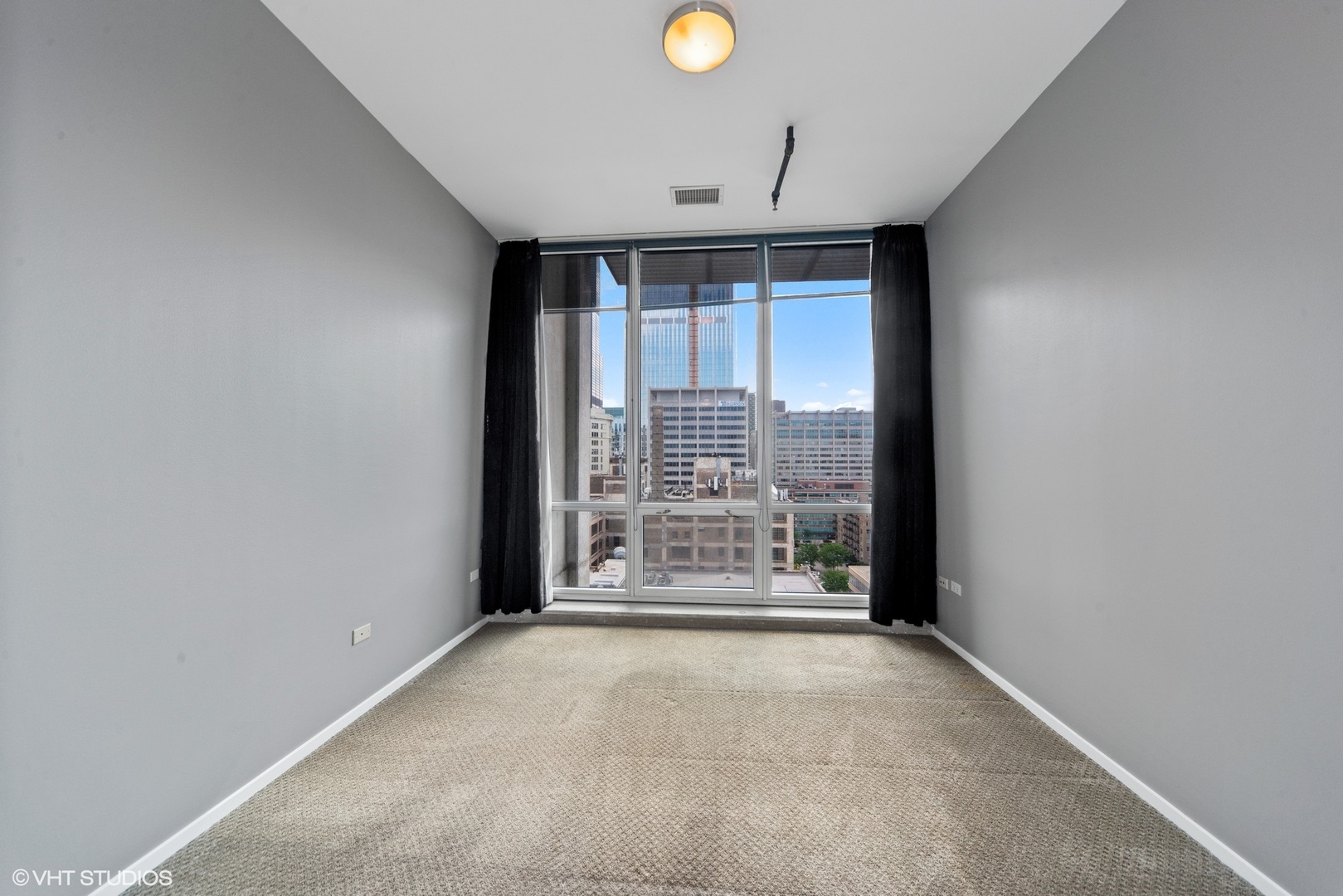 700 West Van Buren Street, Unit PH3 Chicago, IL 60607 - Photo 10 of 20 a view of an empty room with a window