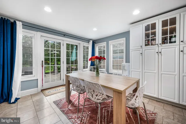 a view of a dining room with furniture and window