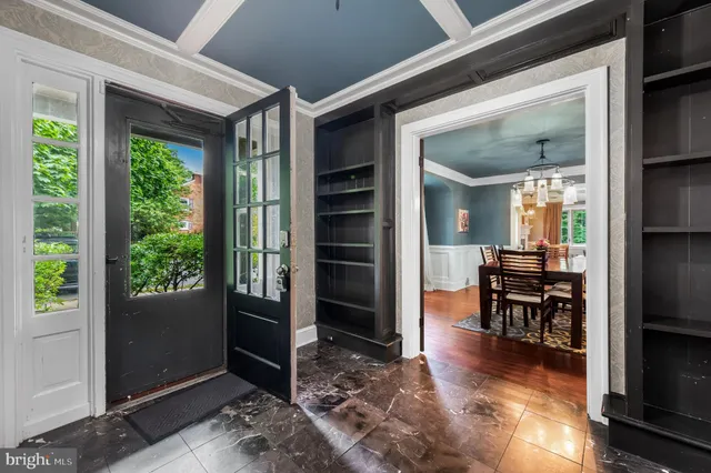 a view of a livingroom with furniture and front door