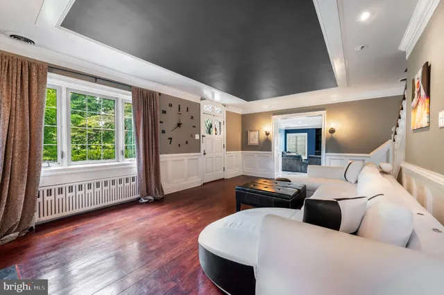 a bedroom with a large bed and a large window