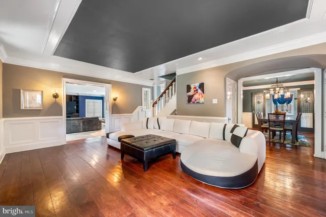 a living room with fireplace furniture and a wooden floor
