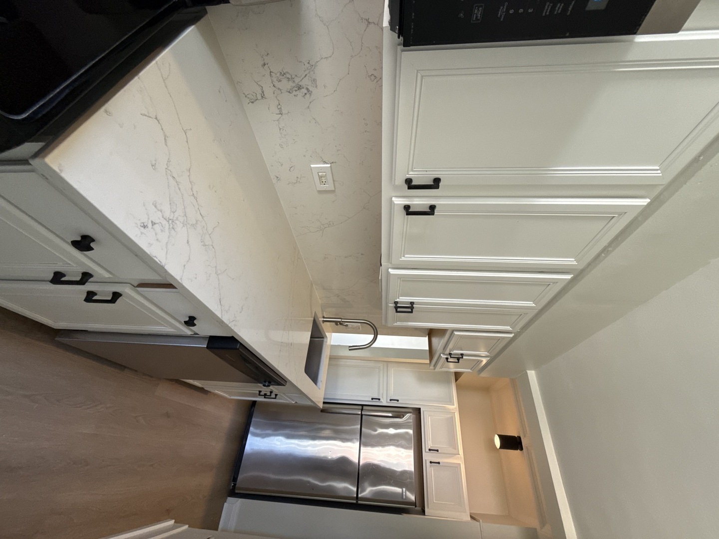 1211 North LaSalle Drive, Unit 401 Chicago, IL 60610 - Photo 2 of 15 a view of staircase with a rug