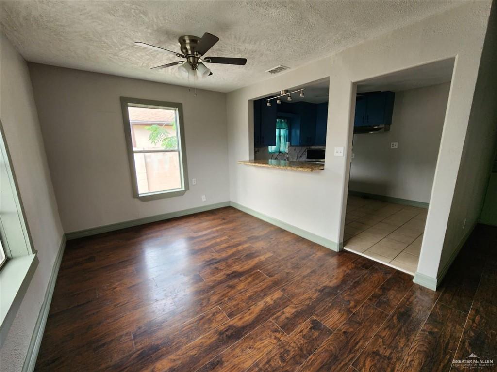 2002 Thornton Street Mission, TX 78572 - Photo 12 of 20 an empty room with wooden floor and windows