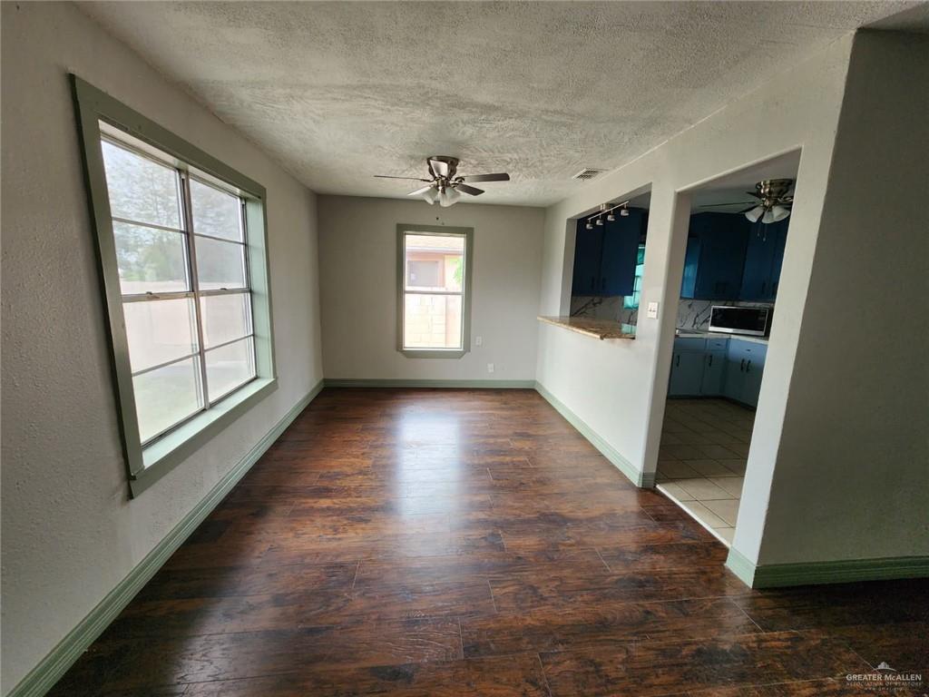 2002 Thornton Street Mission, TX 78572 - Photo 13 of 20 wooden floor in an empty room with a window