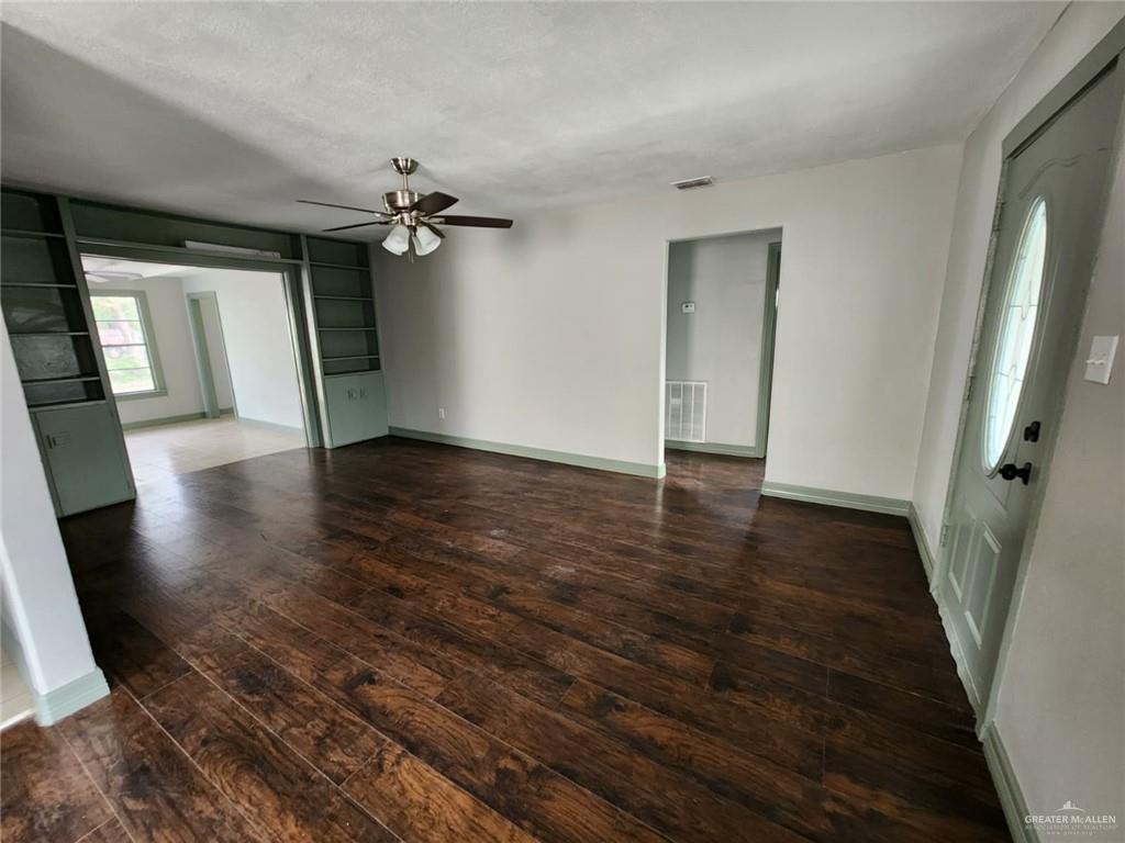 2002 Thornton Street Mission, TX 78572 - Photo 18 of 20 wooden floor in an empty room with a window