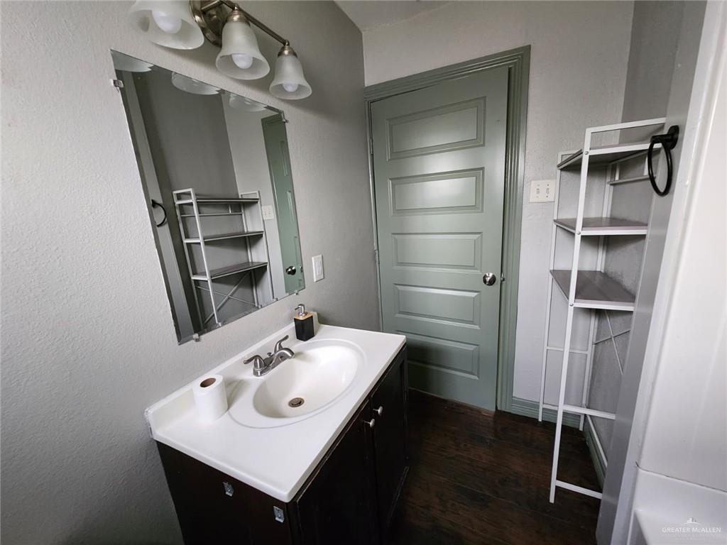 2002 Thornton Street Mission, TX 78572 - Photo 2 of 20 a bathroom with a sink a mirror and shower
