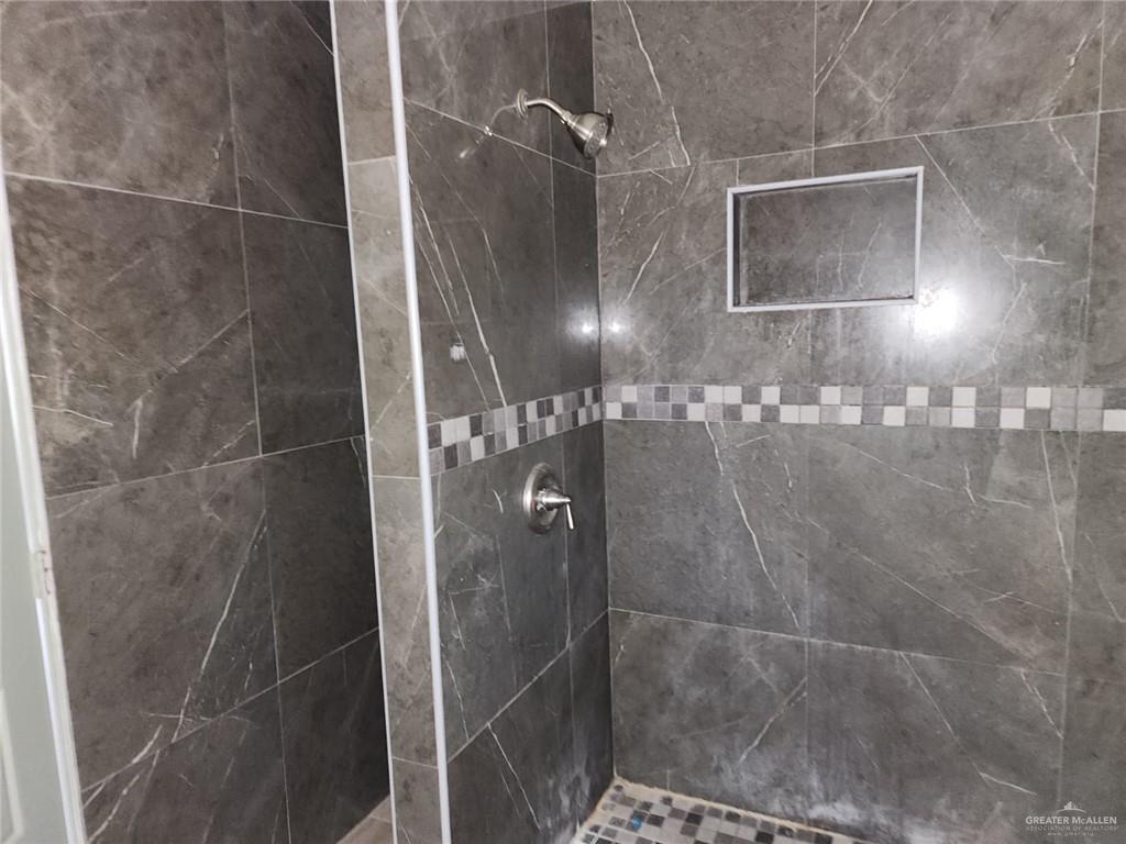 2002 Thornton Street Mission, TX 78572 - Photo 5 of 20 a bathroom with a shower