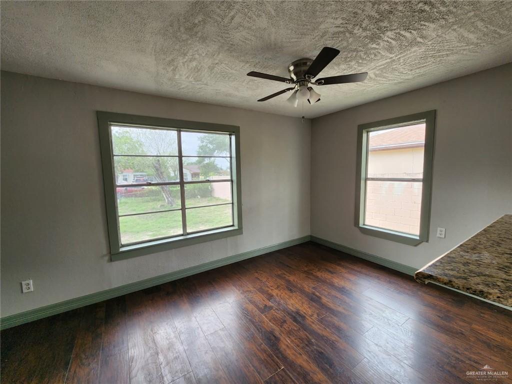 2002 Thornton Street Mission, TX 78572 - Photo 6 of 20 a view of an empty room with wooden floor and a window