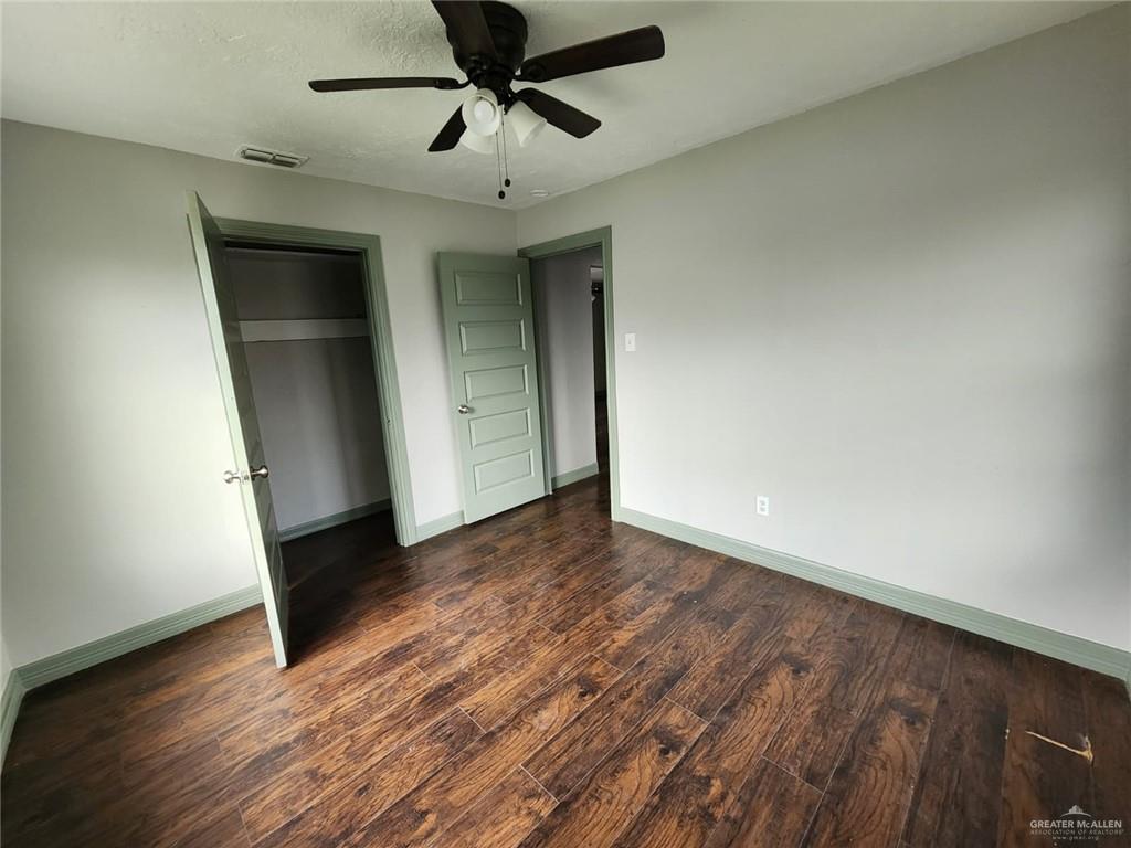 2002 Thornton Street Mission, TX 78572 - Photo 7 of 20 an empty room with wooden floor closet and windows