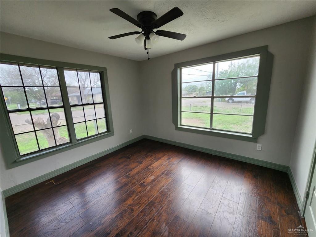 2002 Thornton Street Mission, TX 78572 - Photo 9 of 20 a view of an empty room with wooden floor and a window