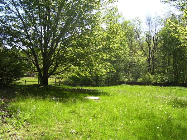 78 Blood Road Charlton, MA 01507 - Photo 19 of 25 a view of a lake with a yard