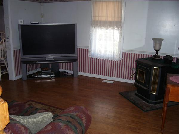 78 Blood Road Charlton, MA 01507 - Photo 20 of 25 a living room with furniture and a flat screen tv
