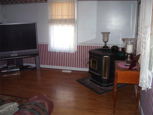 78 Blood Road Charlton, MA 01507 - Photo 21 of 25 a living room with furniture a flat screen tv and a window