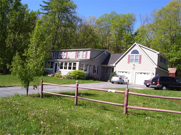 78 Blood Road Charlton, MA 01507 - Photo 4 of 25 a front view of a house with a yard