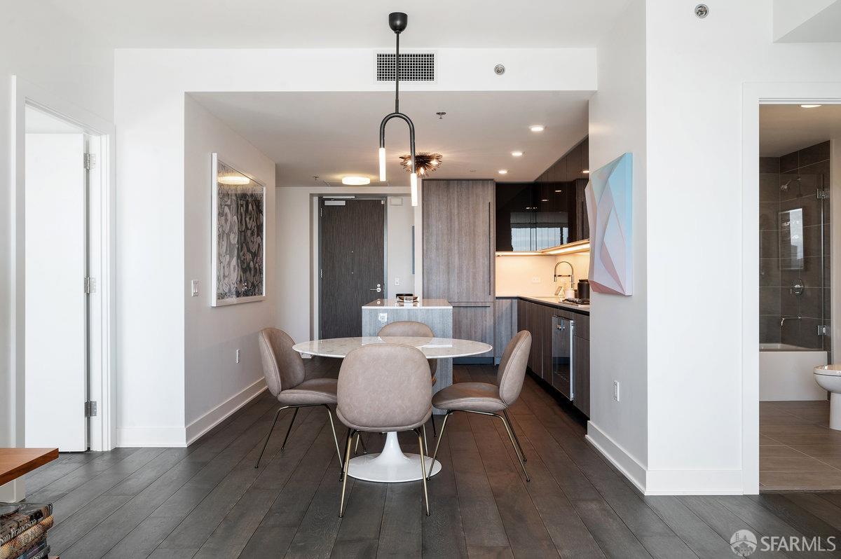 201 Folsom Street, Unit 22F San Francisco, CA 94105 - Photo 15 of 53 a view of a dining room with furniture window and wooden floor