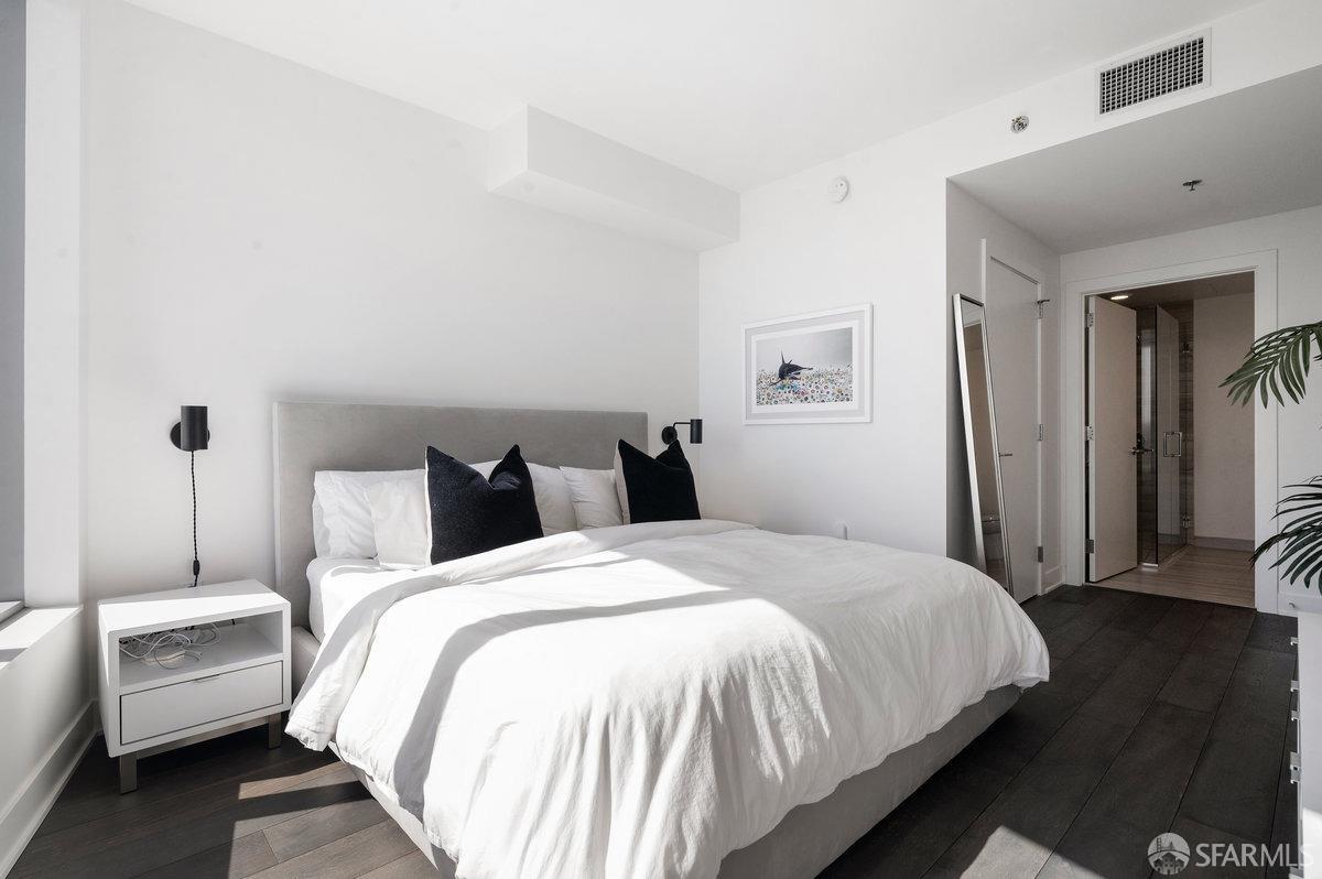 201 Folsom Street, Unit 22F San Francisco, CA 94105 - Photo 16 of 53 a bedroom with bed and a night stand