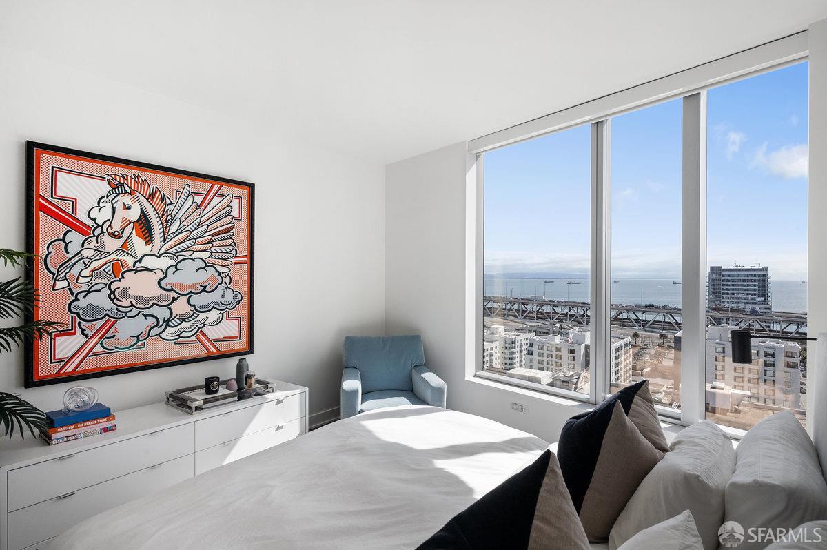 201 Folsom Street, Unit 22F San Francisco, CA 94105 - Photo 18 of 53 a bedroom with a bed and glass window
