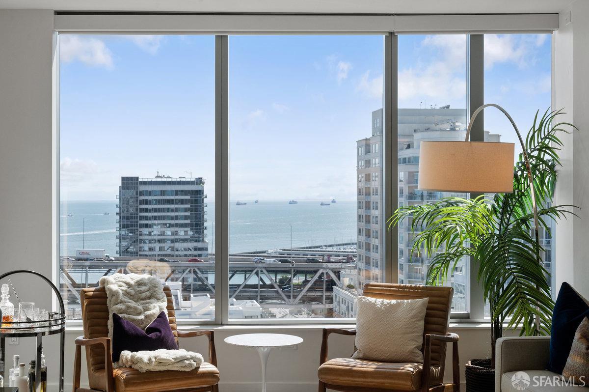 201 Folsom Street, Unit 22F San Francisco, CA 94105 - Photo 2 of 53 a view of a balcony with chairs and floor to ceiling window