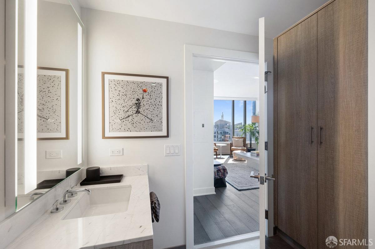 201 Folsom Street, Unit 22F San Francisco, CA 94105 - Photo 22 of 53 a bathroom with a tub sink and view of living room