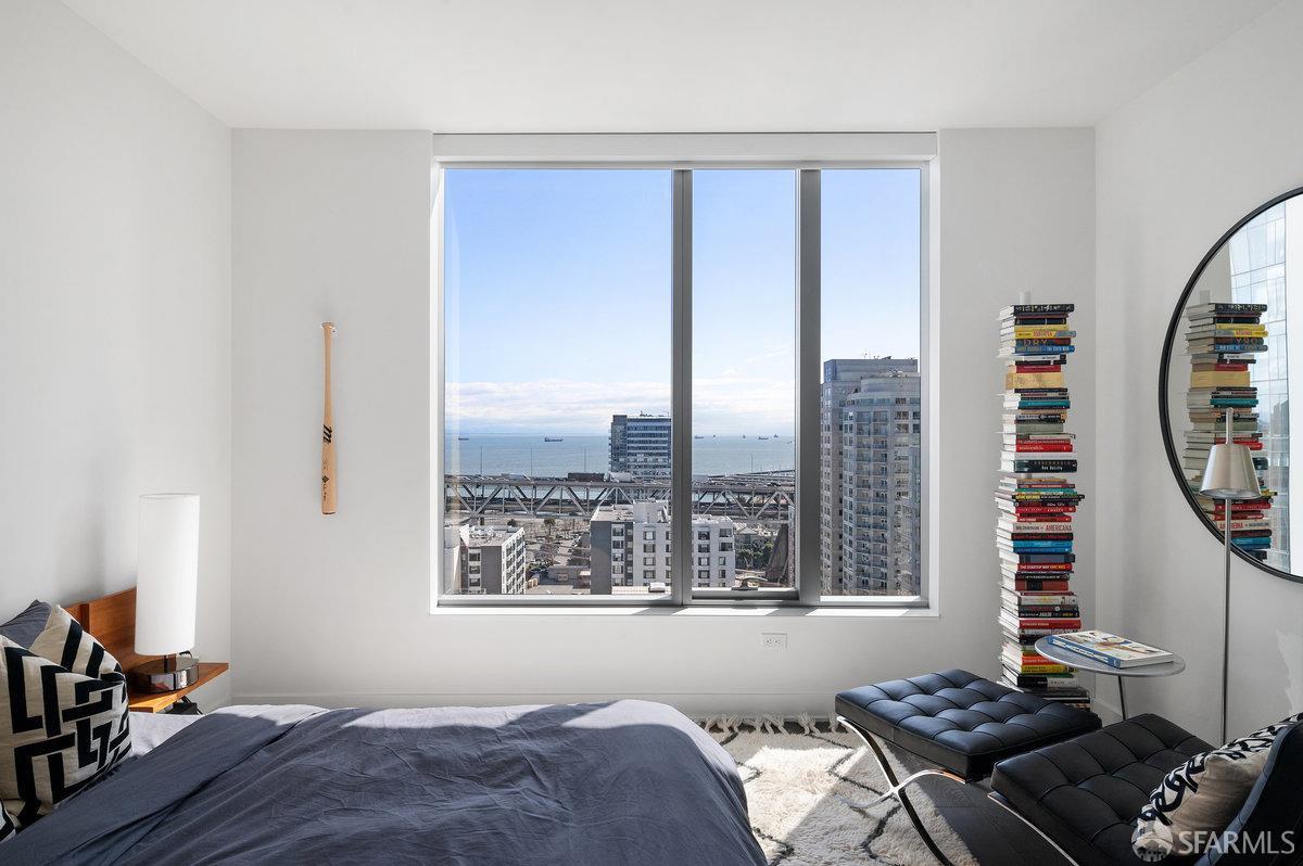 201 Folsom Street, Unit 22F San Francisco, CA 94105 - Photo 25 of 53 a bedroom with a bed and a window