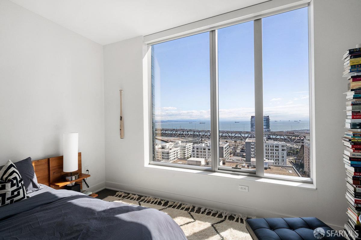 201 Folsom Street, Unit 22F San Francisco, CA 94105 - Photo 26 of 53 a bedroom with bed and a window