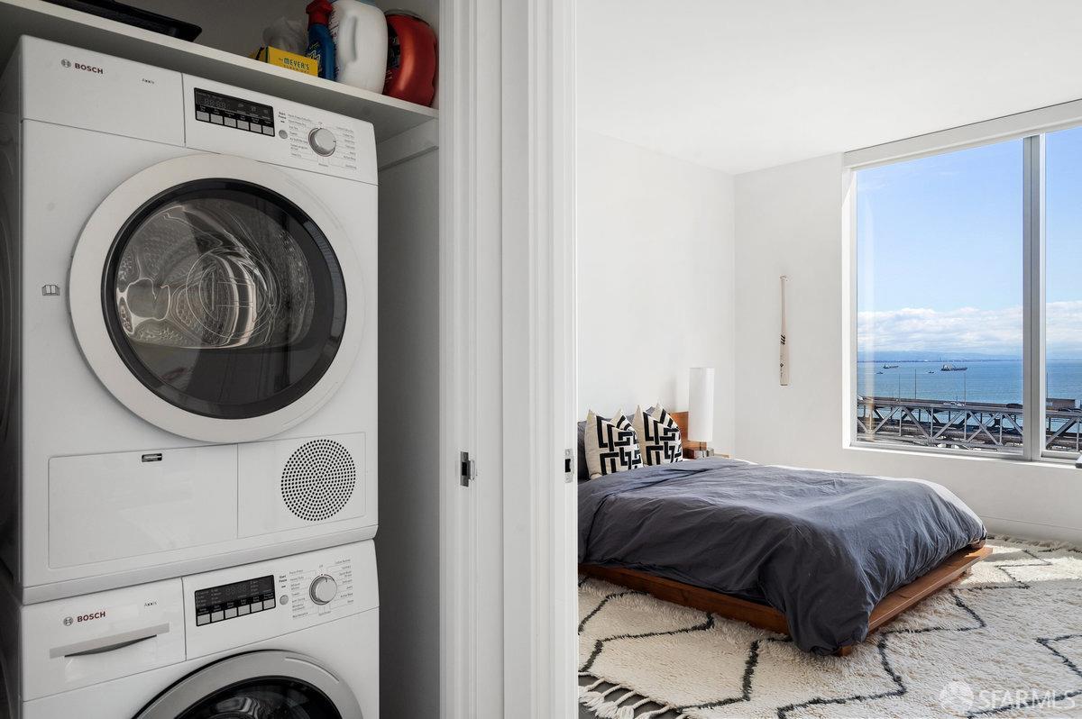 201 Folsom Street, Unit 22F San Francisco, CA 94105 - Photo 30 of 53 a bedroom with a bed and a large window