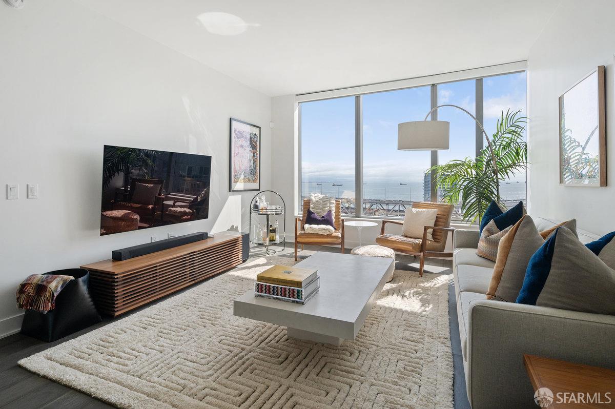 201 Folsom Street, Unit 22F San Francisco, CA 94105 - Photo 4 of 53 a living room with furniture and a flat screen tv