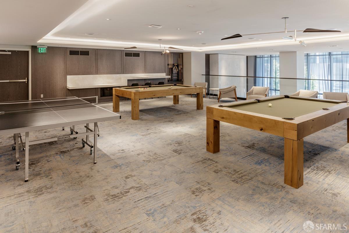 201 Folsom Street, Unit 22F San Francisco, CA 94105 - Photo 46 of 53 a room with lots of furniture and a table