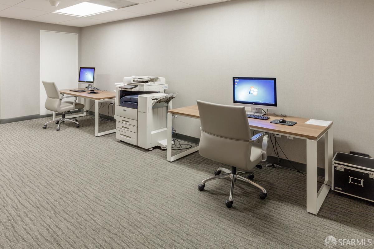 201 Folsom Street, Unit 22F San Francisco, CA 94105 - Photo 47 of 53 a work room with furniture and a wooden floor
