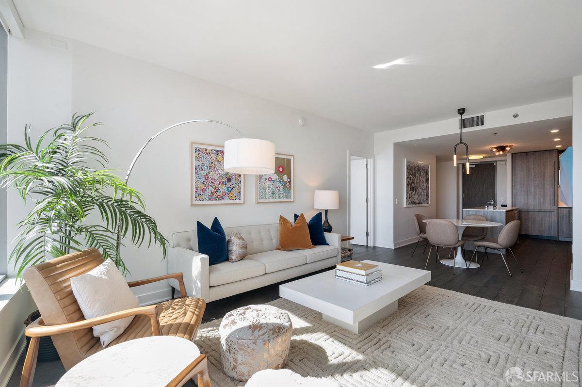 201 Folsom Street, Unit 22F San Francisco, CA 94105 - Photo 5 of 53 a living room with furniture and wooden floor