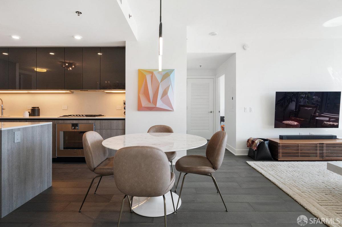 201 Folsom Street, Unit 22F San Francisco, CA 94105 - Photo 7 of 53 a living room with furniture and a flat screen tv