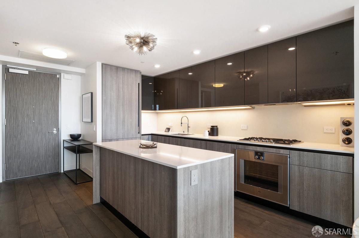 201 Folsom Street, Unit 22F San Francisco, CA 94105 - Photo 10 of 53 a kitchen with a stove and a sink