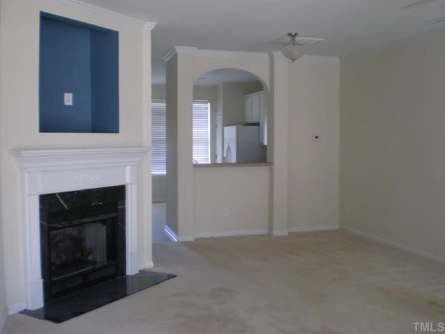 Spacious family room with dining area.  Gas log fireplace with TV niche above.