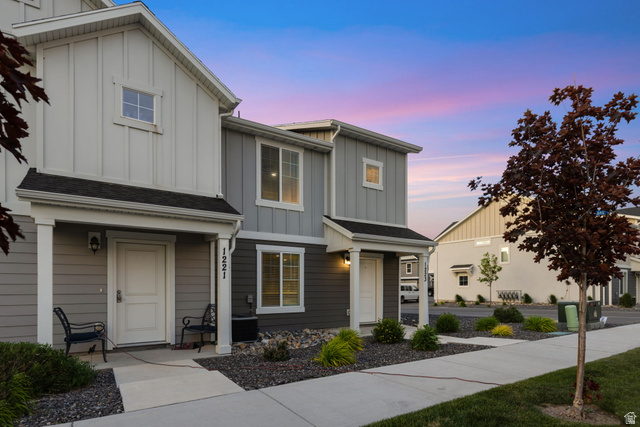 1223 East 1775 North Payson, UT 84651 - Photo 11 of 45 Modern multi-story exterior featuring two-tone siding, a covered entry porch, and a sidewalk leading to the front door