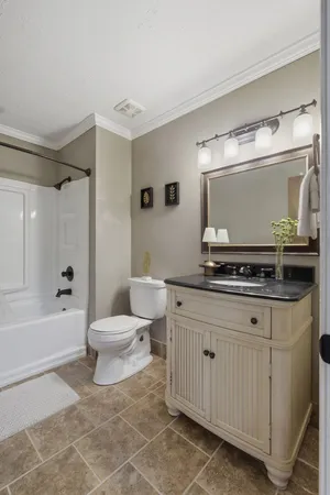 a bathroom with a toilet a sink and a bathtub