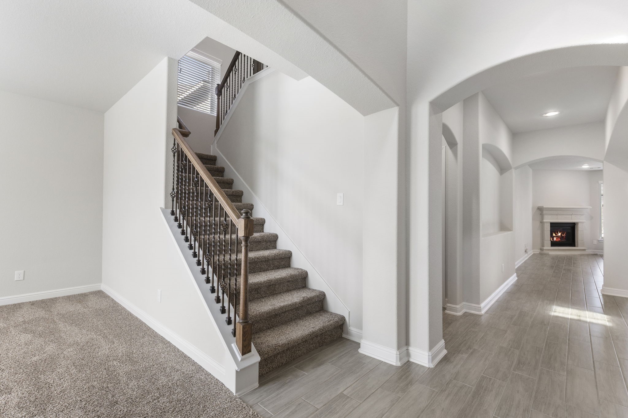 2819 Bradbury Hills Road Spring, TX 77373 - Photo 8 of 50 As you enter, a charming staircase invites you to explore the second floor, promising more of this home's elegance and warmth.